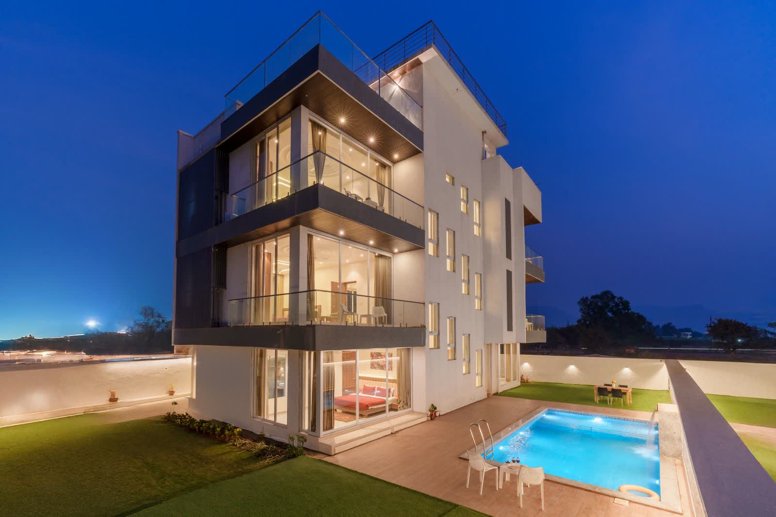 A house listed for sale, photographed from the garden